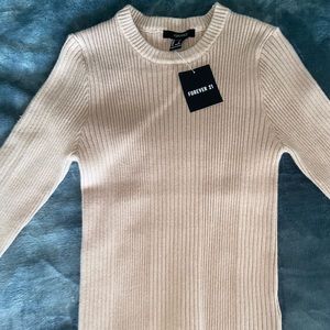 Form-fitting sweater